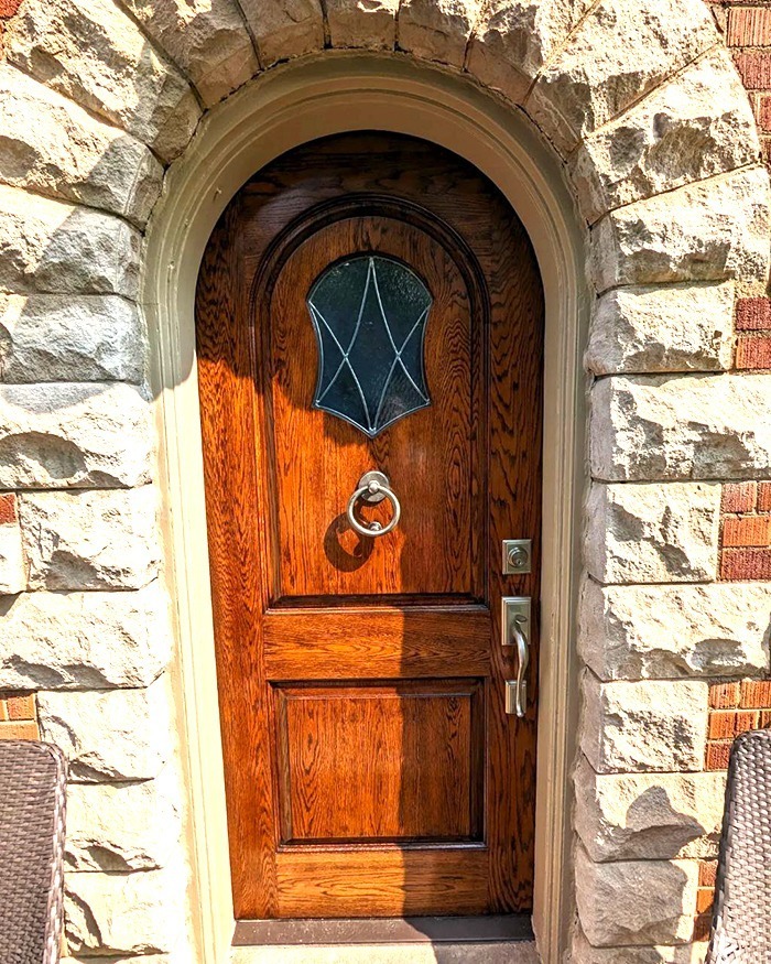 After curation of red mahogany stain and varnish applied to a red oak door in Leaside Toronto
