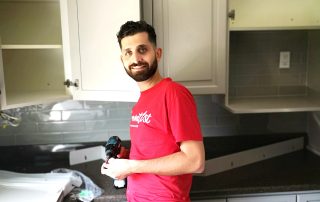 Completed kitchen spraying project in Erin, Toronto, featuring Benjamin Moore semi-gloss AF 685 Thunder on cabinets