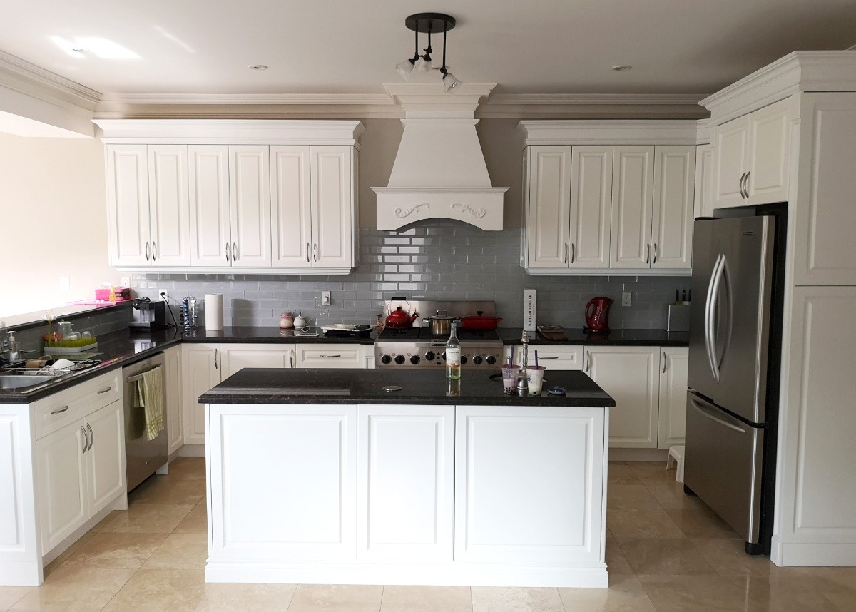 ompleted kitchen spraying project in North York, Toronto, featuring Benjamin Moore semi-gloss Cloud White OC-130 on cabinets