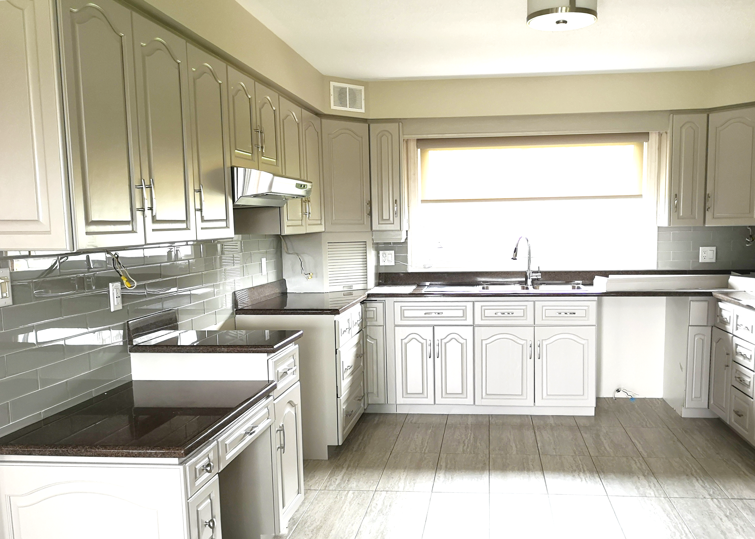 Completed kitchen spraying project in Erin, Toronto, featuring Benjamin Moore semi-gloss AF 685 Thunder on cabinets.