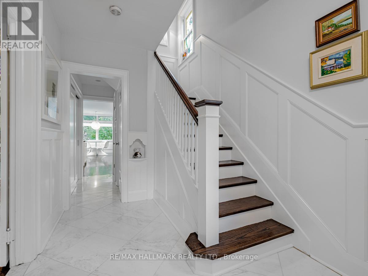 Chromatist painters bring timeless elegance to this historic Bennington Heights residence. Wainscoting, trims, staircase risers, and pickets, expertly painted in fresh white, seamlessly blend tradition with modern characteristic.