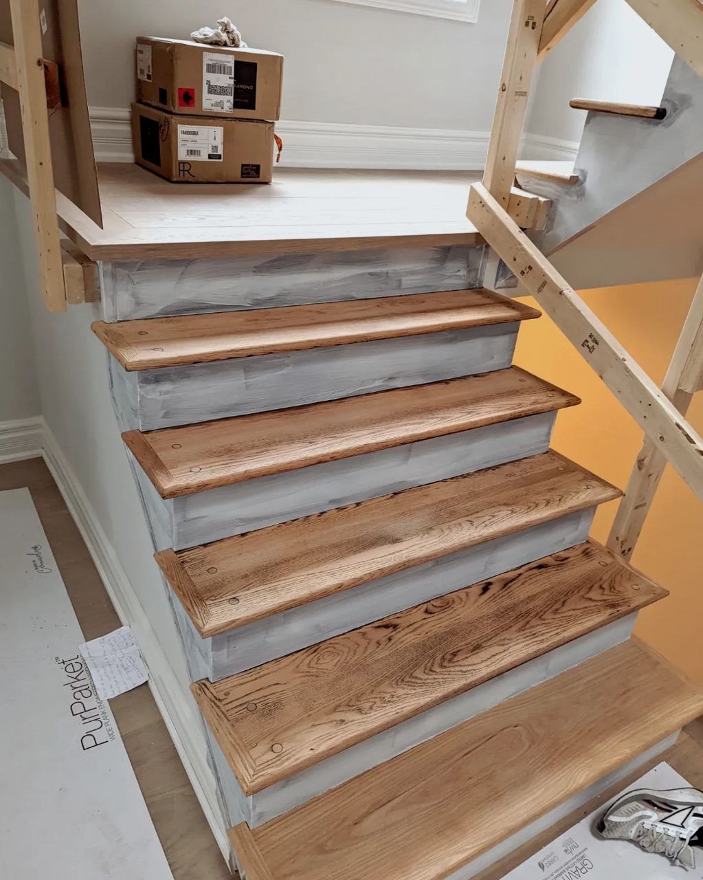 Stairs refinishing project in Oakville during a full renovation of a house. Bare wood after sanding old stain and varnish.