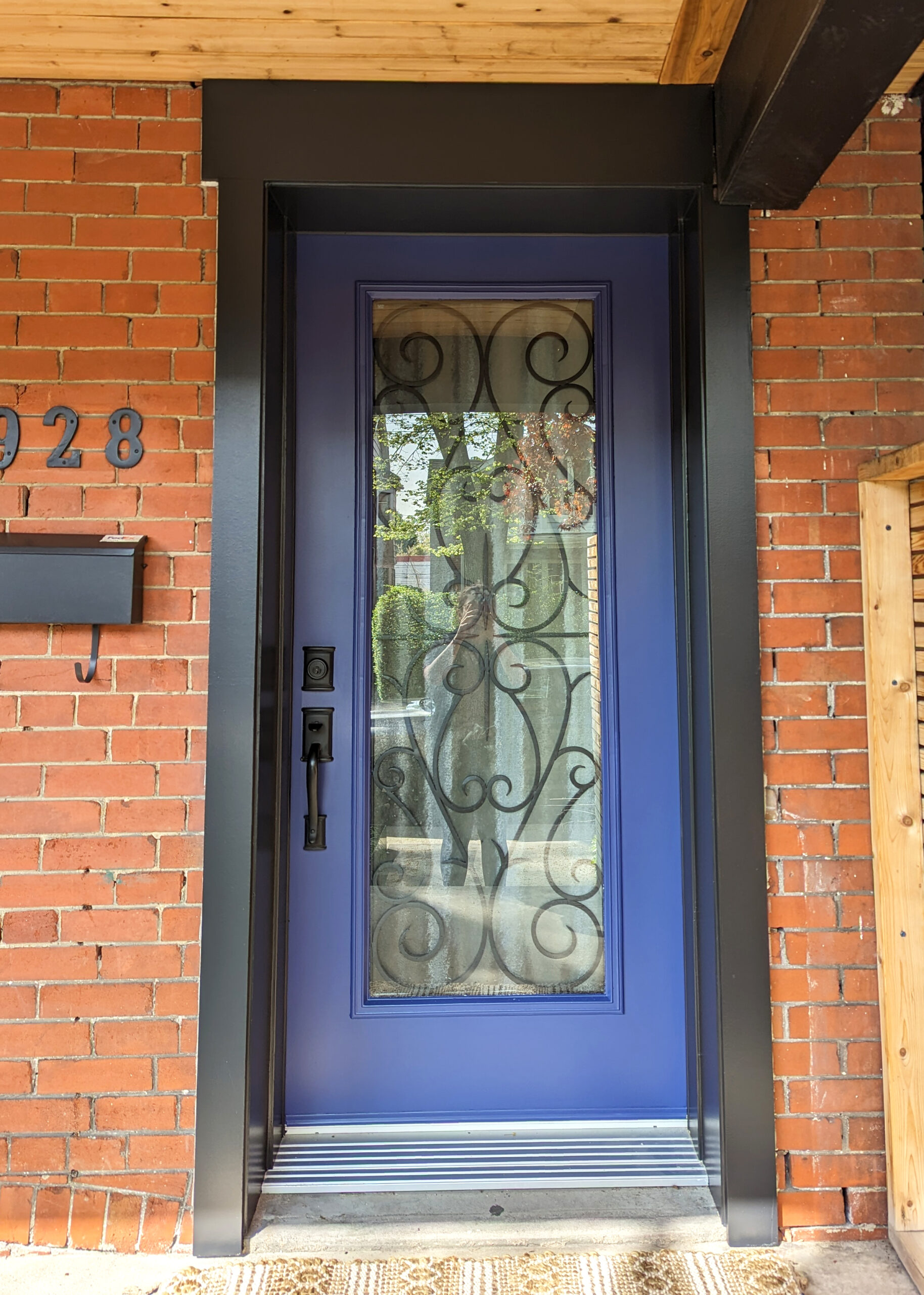 Exterior entrance door painting in dark blue in Bennington Heights