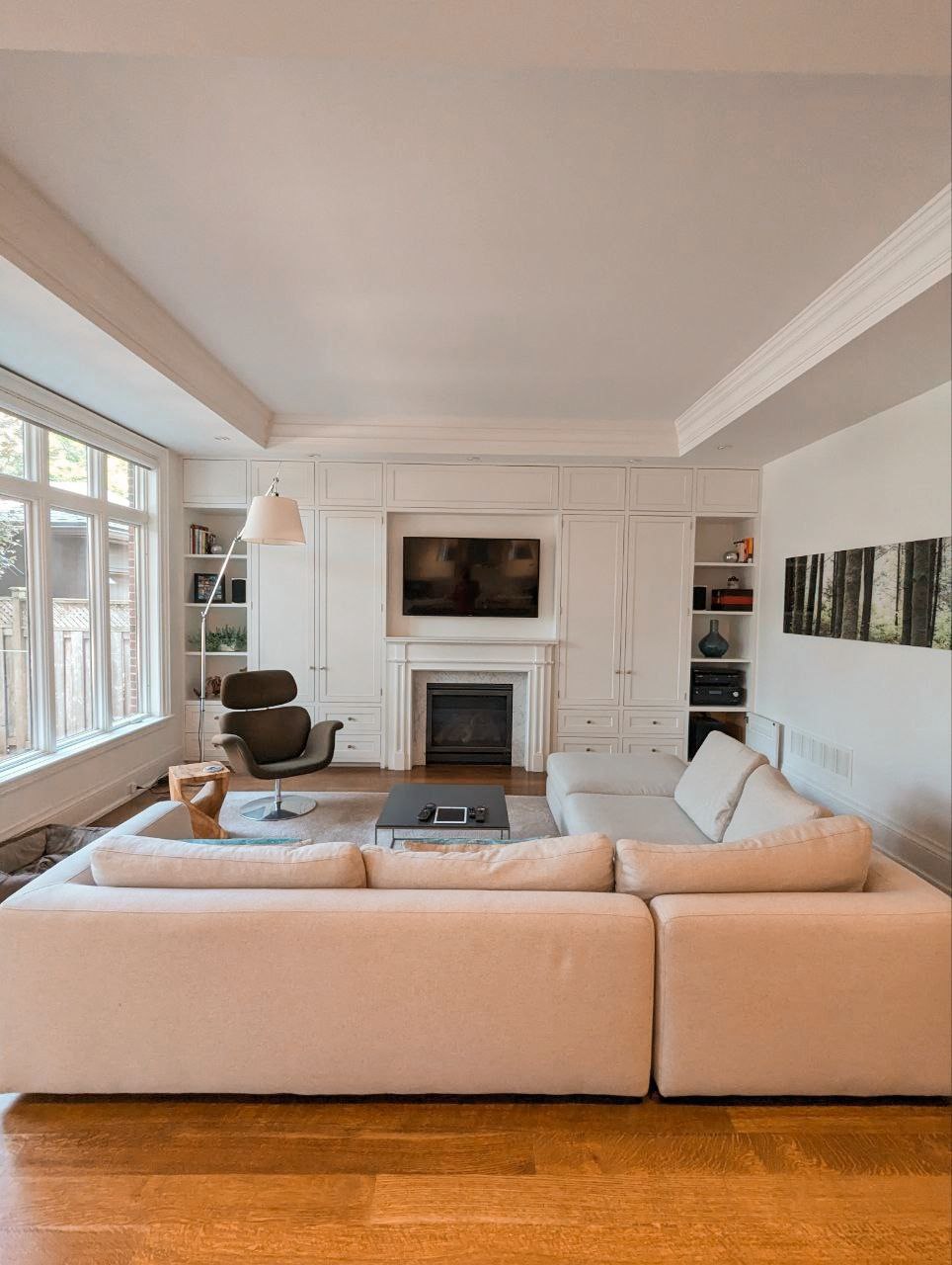 After photos of a full house painting of interior in Rosedale, experience the transformative elegance of crisp white walls baseboards, wainscoting