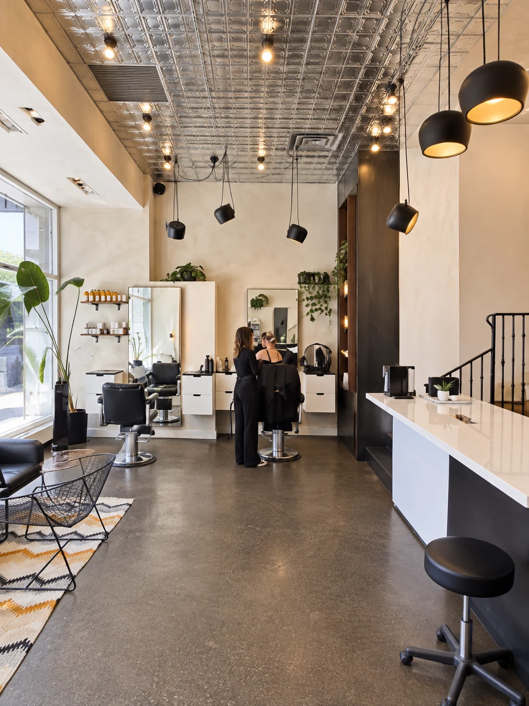 Commercial Limewash Painting Toronto – Barbershop Interior Warm limewash walls in a high-end downtown Toronto barbershop interior
