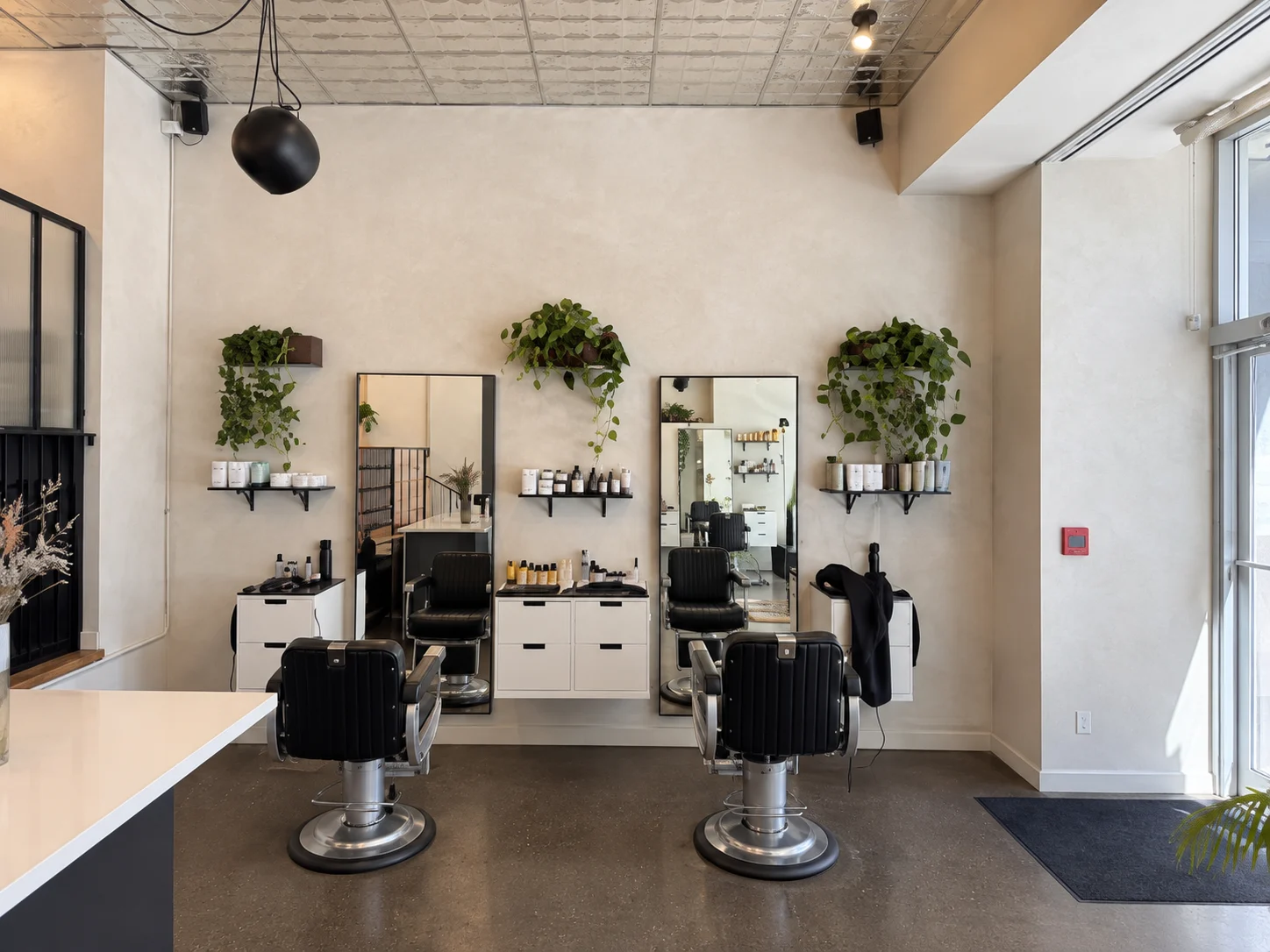 Commercial Limewash Walls – Downtown Toronto Styling Area Commercial limewash walls surrounding barber chairs in a downtown Toronto salon