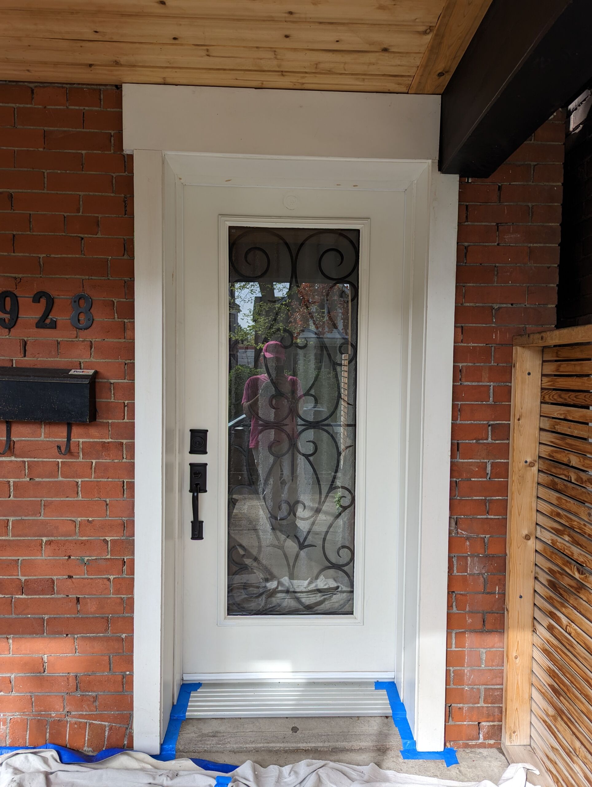 Vinyl door in Toronto before painting, featuring a cream color finish. Preparation for painting included full Stix primer and patching.
