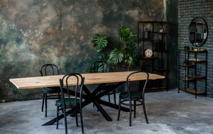 Stylish café interior with grey, green, and gold Venetian plaster walls