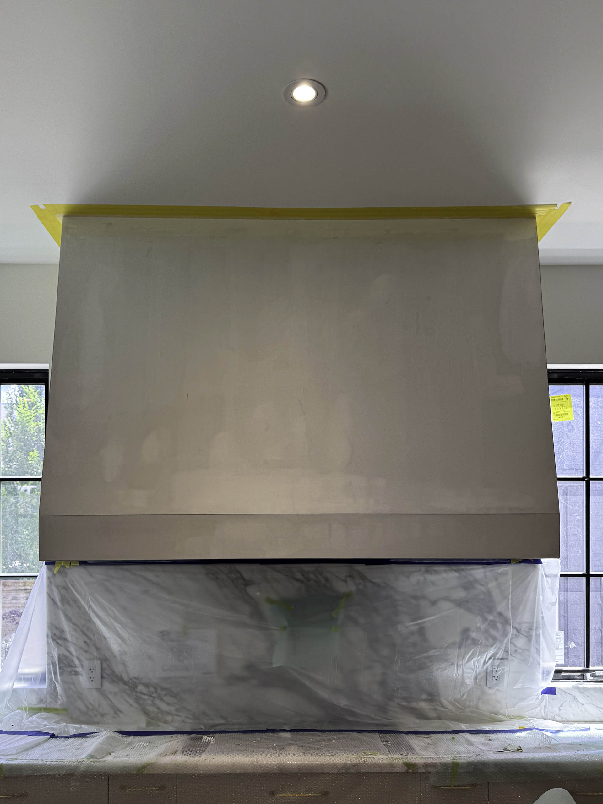 Standard kitchen range hood before Venetian plaster marmorino installation in Mississauga home.