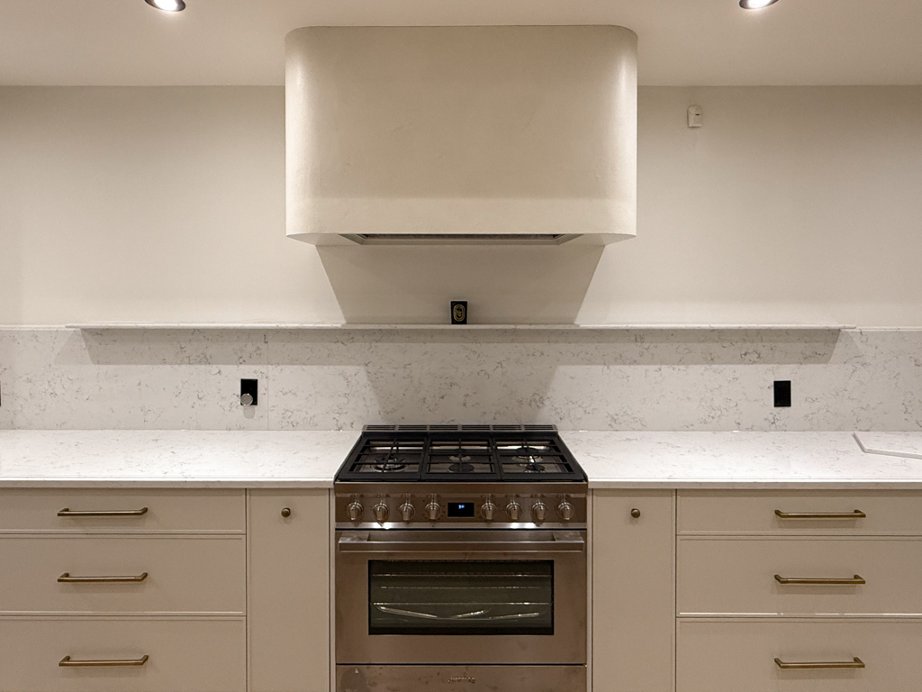 Range hood finishes: venetian plaster finish for free standing range hood, barnished soft for a soft sheen, sealed for washability, marmorino finish in off-white colour, Sherwin Williams Alabaster colour to match cabinets, venetian plaster installation project in palgrave, toronto