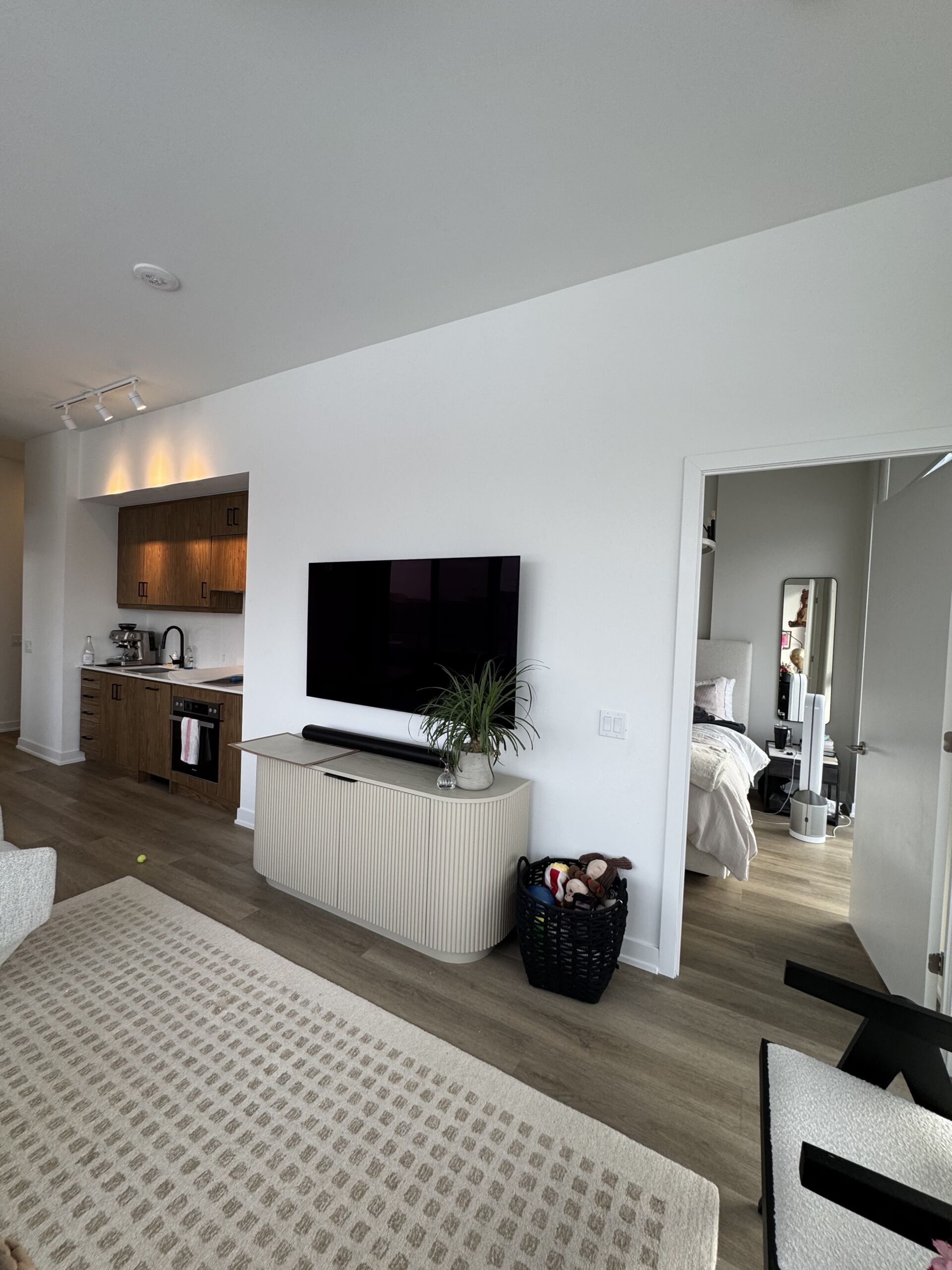 Tall ceilings and walls with white matte finish before the application of sage green limewash to the walls.