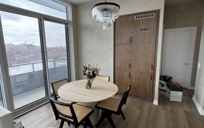 Sage green limewash application in living room in a Toronto condo