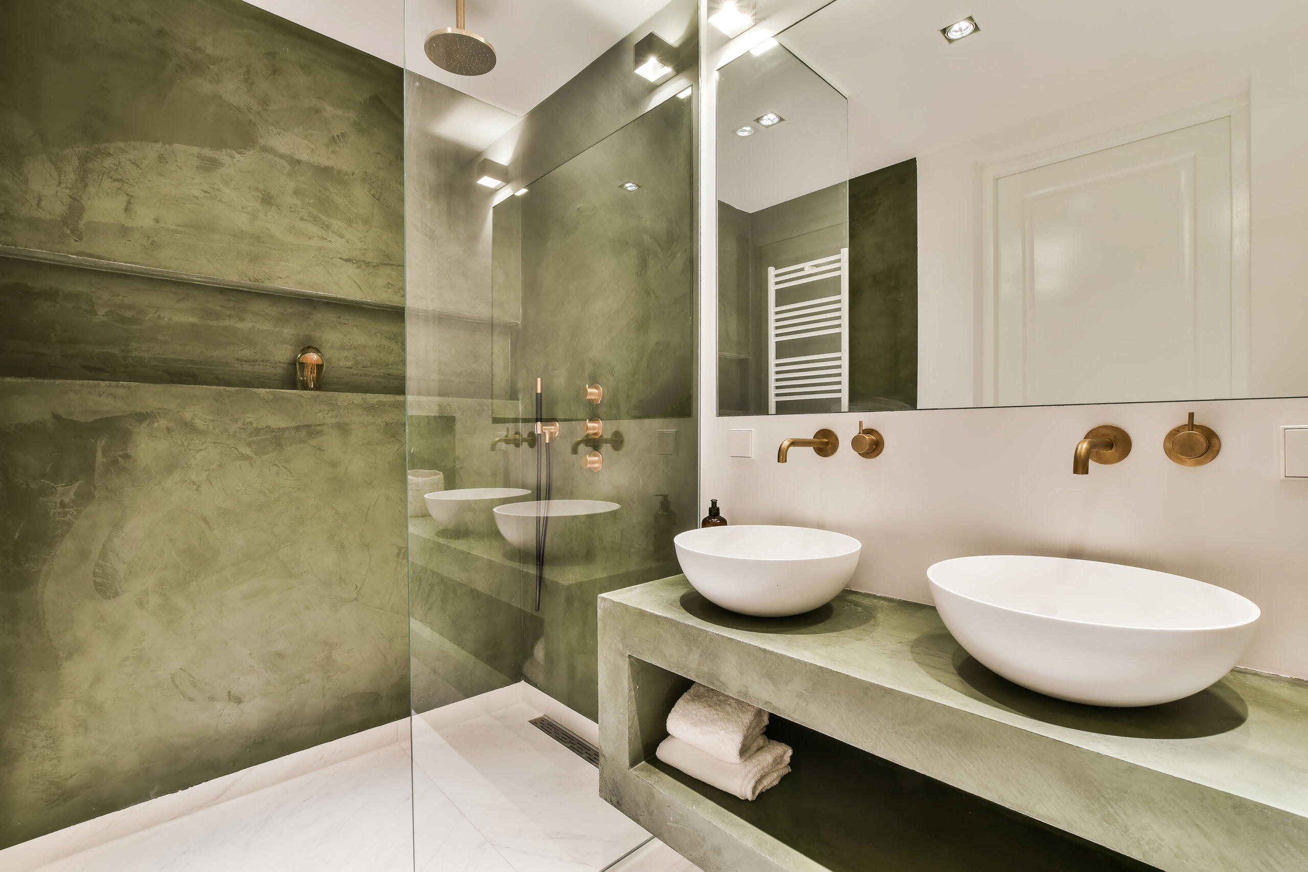 Bathroom with green decorative plaster wall