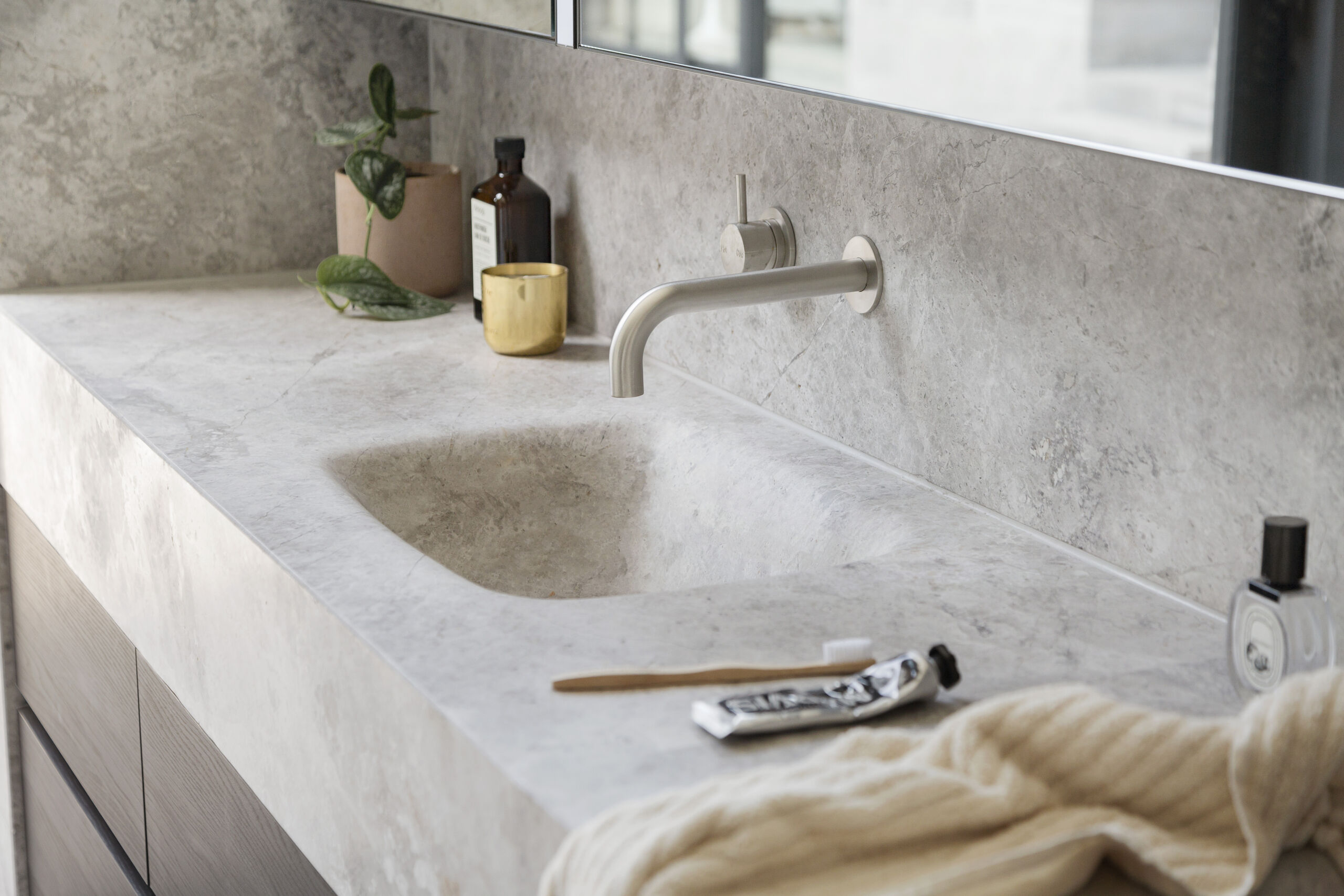 bathroom-vanity-in-microcement-finish microcement in bathrooms, bathroom vanity finished in rough microcement