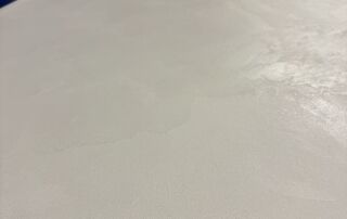 Completed off-white grey microcement countertops in a Toronto coffee roaster, smooth and seamless finish.