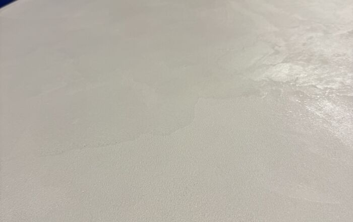 Completed off-white grey microcement countertops in a Toronto coffee roaster, smooth and seamless finish.