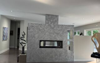 Venetian plaster on fireplace with metallic dual-tone finish in Toronto living room