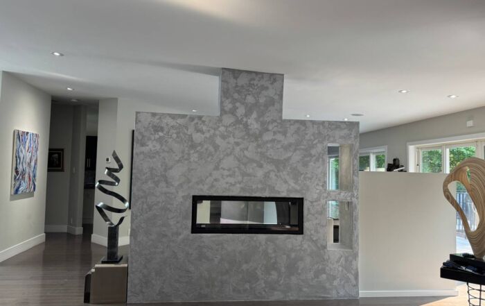 Venetian plaster on fireplace with metallic dual-tone finish in Toronto living room