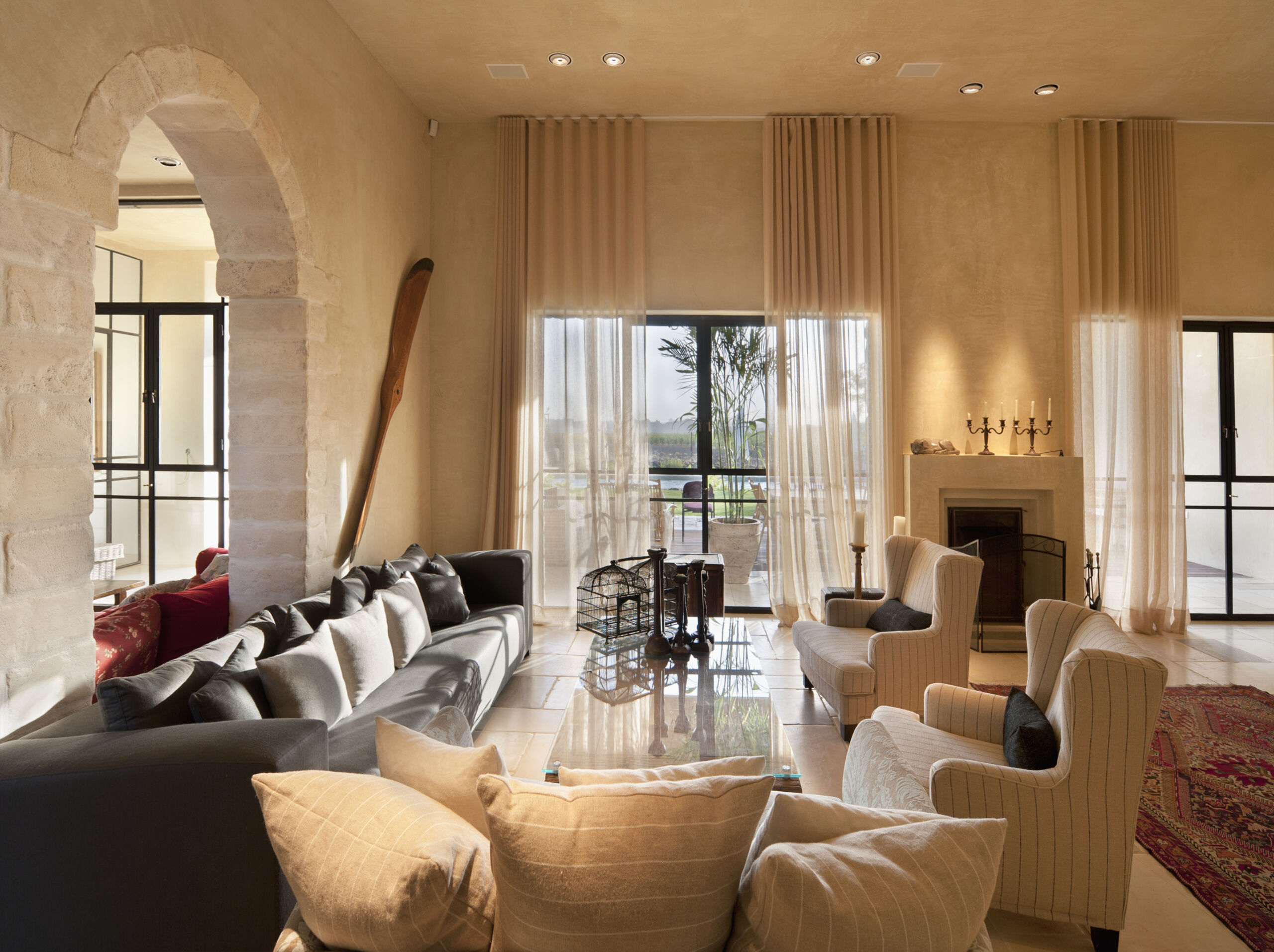 Luxury living room walls and ceilings finished in warm ochre limewash