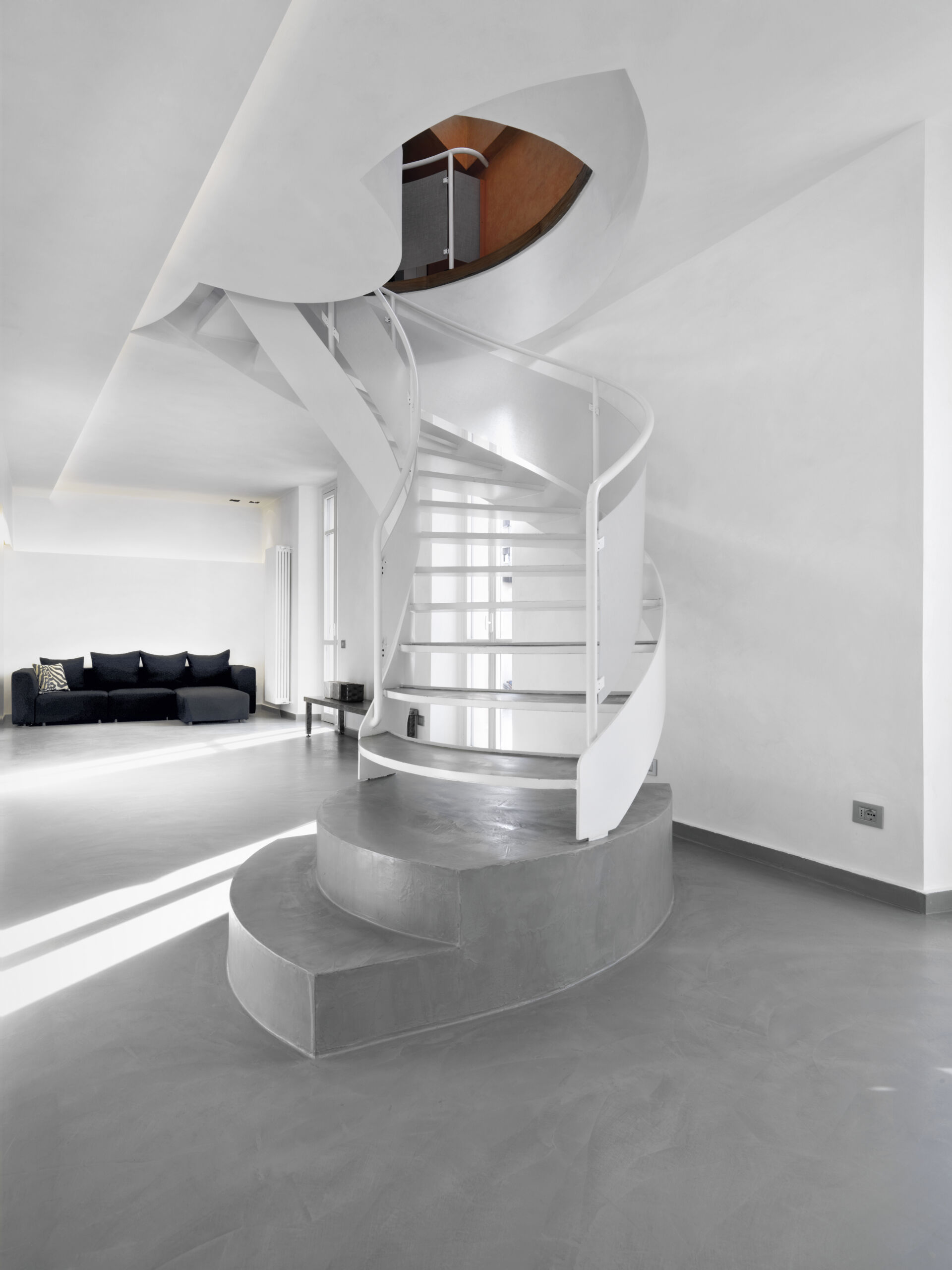 Polished Concrete vs Microcement Floors in Modern Living Room Design Polished concrete vs microcement floors shown in the interior of a modern living room with polished concrete flooring.