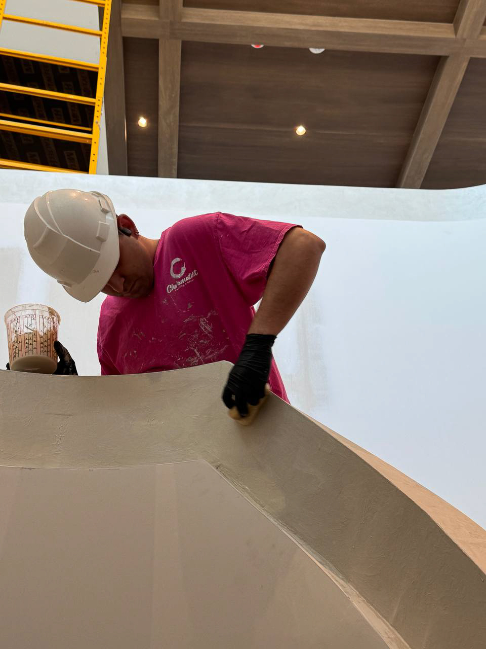velvet-modern-venetian-plaster-finish-for-staircase-handrail-for-royal-bayview-residences-by–tridel-in-thornhill11 Artisan applying modern Venetian plaster finish to stair handrail at Royal Bayview, Thornhill.