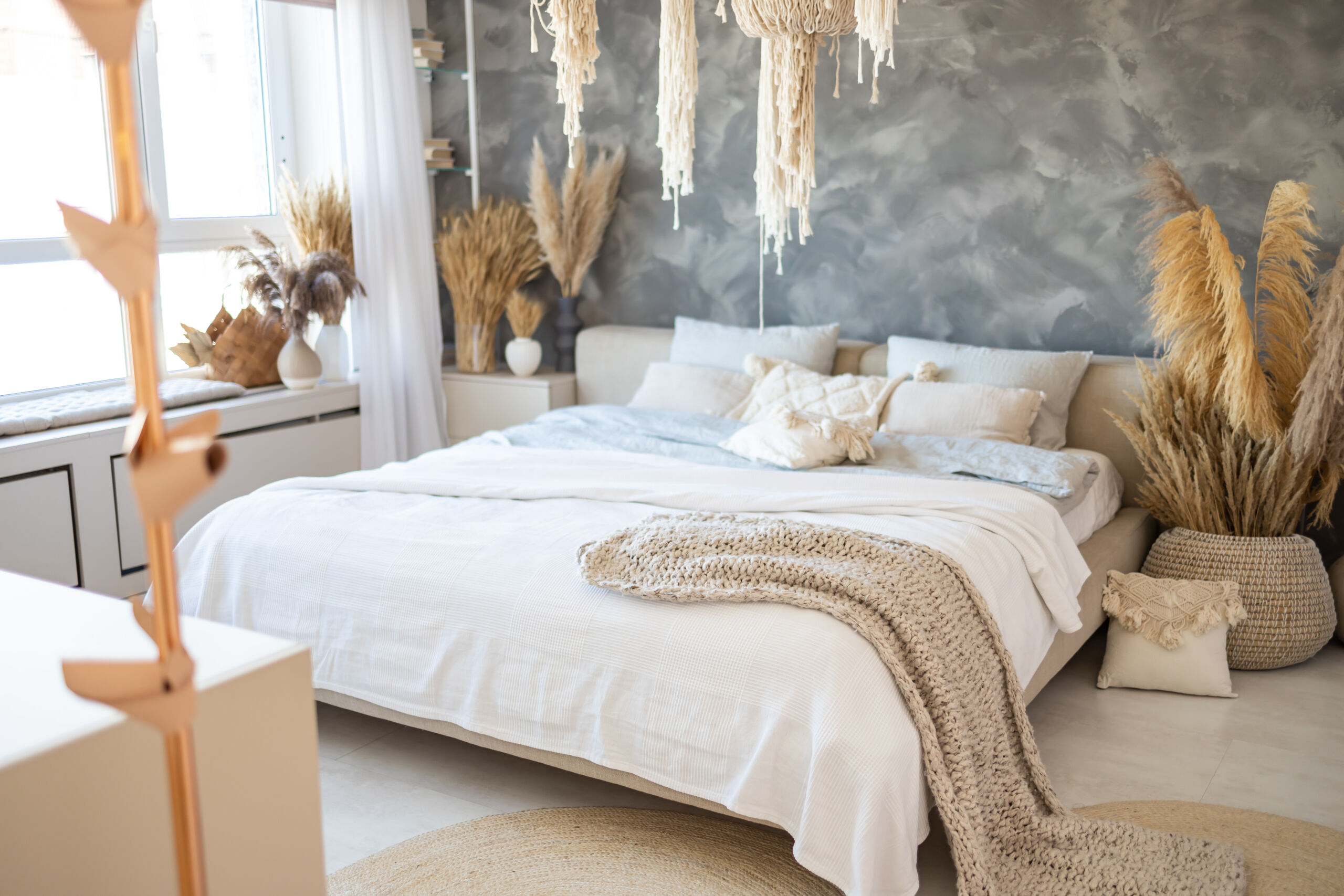 White and Charcoal Limewash Walls in Jacksonville Loft Bedroom Limewash Aesthetics: Earthy, Lived-In, and Authentic: White and charcoal limewash walls in a modern bedroom interior of a Jacksonville loft