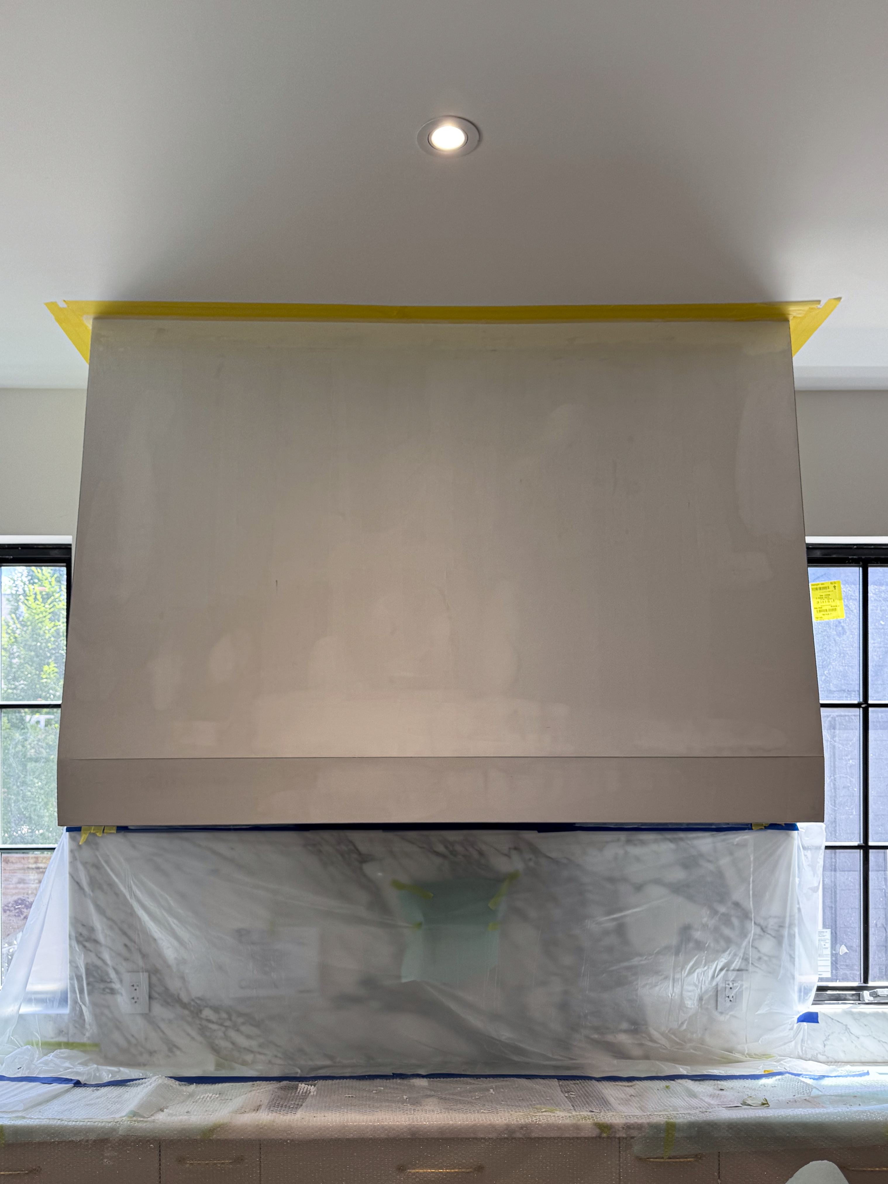 natural-venetian-plaster-range-hood-installation-etobicoke-toronto4 A plain, unfinished MDF kitchen hood in a new kitchen construction, waiting for a final surface finish.