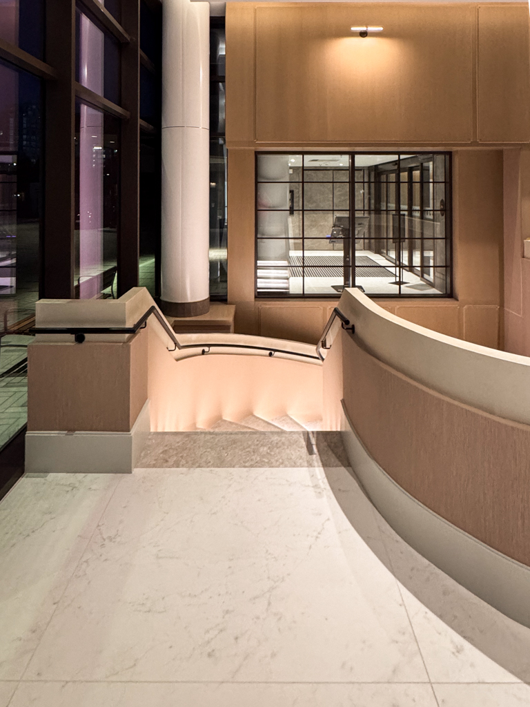 velvet-venetian-plaster-installation-staircase-wall-tridel-toronto-1 Staircase in a Tridel lobby finished with wam gray Modern Velvet Venetian Plaster, showcasing a soft, smooth texture