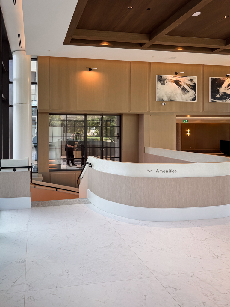 velvet-venetian-plaster-installation-staircase-wall-tridel-toronto-2 Staircase in a Tridel lobby finished with wam gray Modern Velvet Venetian Plaster, showcasing a soft, smooth texture