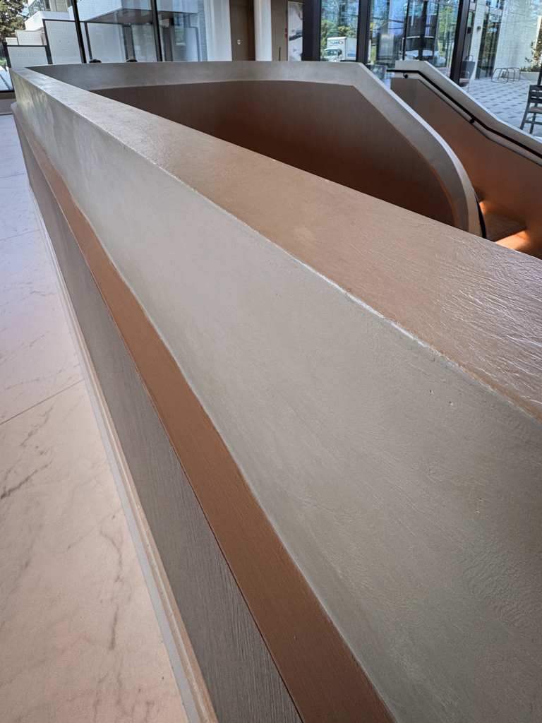 velvet-venetian-plaster-installation-staircase-wall-tridel-toronto-5 Staircase in a Tridel lobby finished with wam gray Modern Velvet Venetian Plaster, showcasing a soft, smooth texture