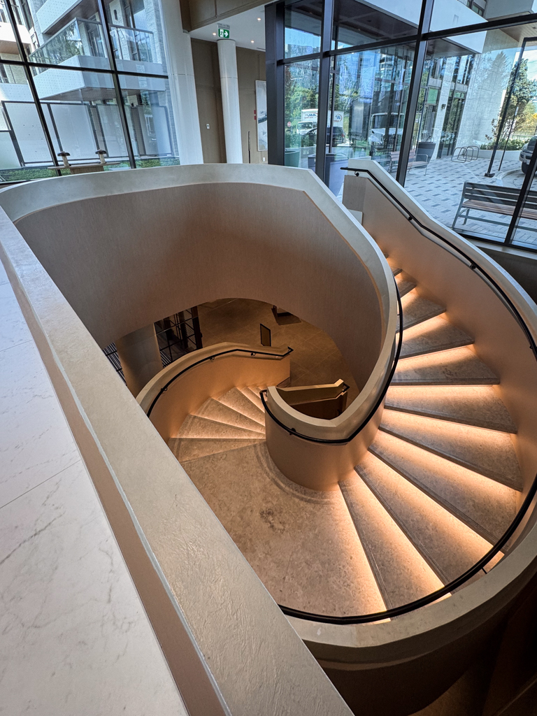 velvet-venetian-plaster-installation-staircase-wall-tridel-toronto-6 Staircase in a Tridel lobby finished with wam gray Modern Velvet Venetian Plaster, showcasing a soft, smooth texture