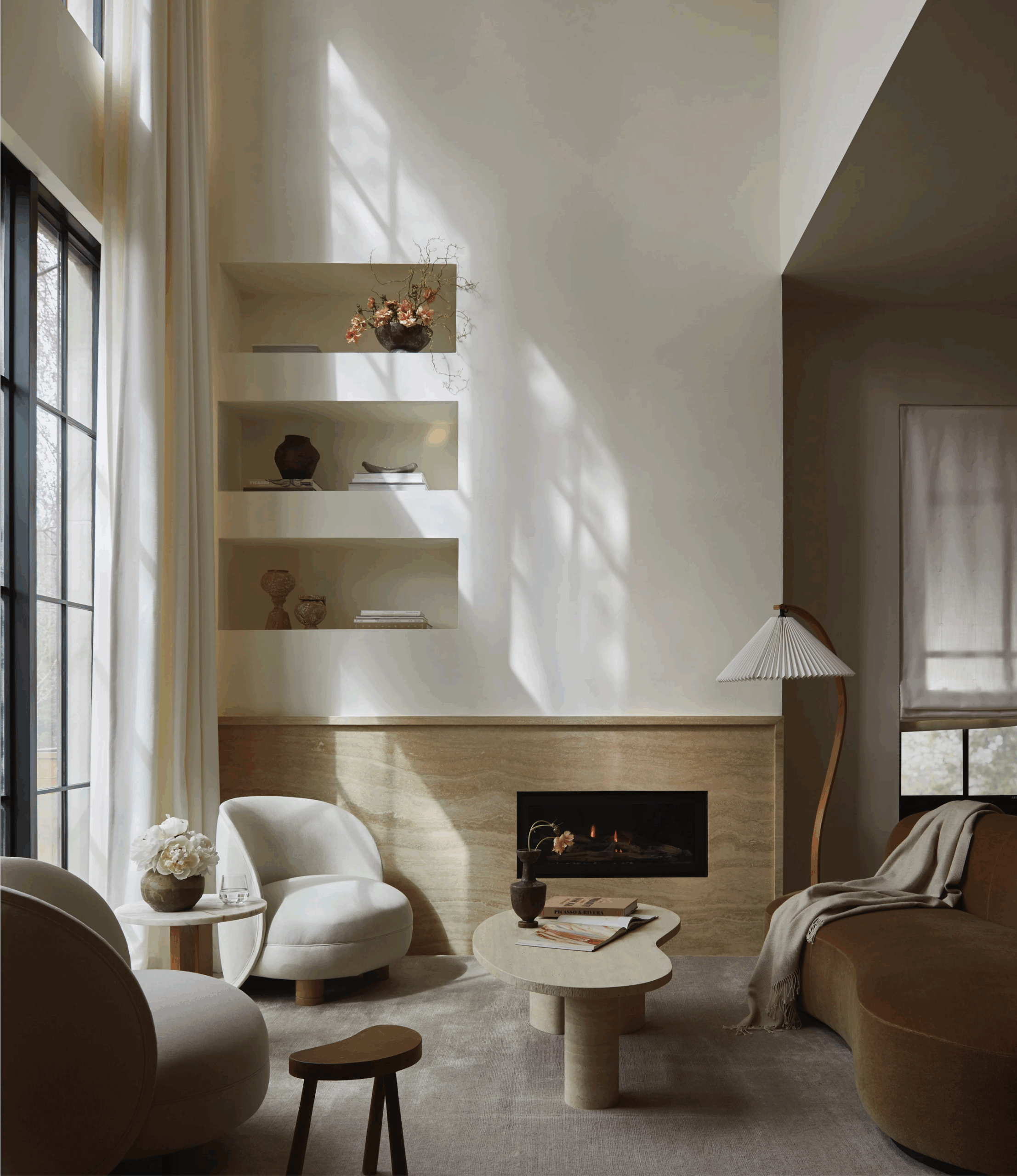 lime-plaster-fireplace-in-warm-white-rosedale-toronto A towering 21-foot fireplace finished in a warm lime plaster, showcasing subtle texture in a Summer Hill residence living room. Photo by Niamh Barry