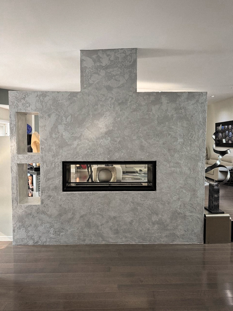 metallic-venetian-plaster-over-fireplace-wall-north york-toronto-1 Detail shot showing the layers and shimmer of the silver metallic Venetian plaster and Marmorino finish.