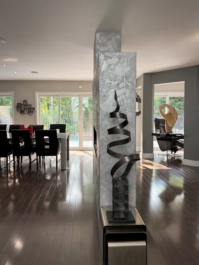 metallic-venetian-plaster-over-fireplace-wall-north york-toronto-5 Detail shot showing the layers and shimmer of the silver metallic Venetian plaster and Marmorino finish.