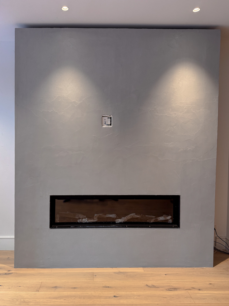 concrete colour microcement surfacing on fireplace in toronto