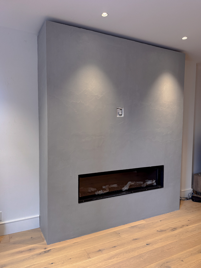 concrete colour microcement surfacing on fireplace in toronto