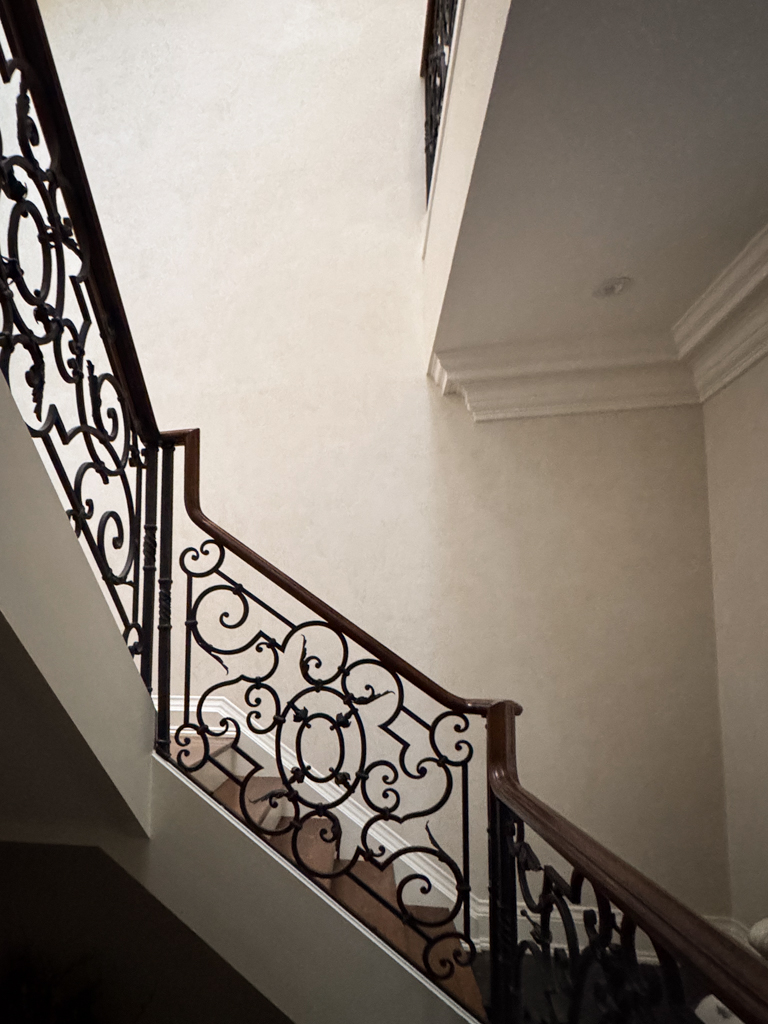 Seamless, high-gloss Venetian plaster finish (Grasello) applied to foyer and hallway walls of a luxury Richmond Hill home.