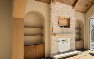 Custom Built-in Media Wall and Stone Fireplace after Microcement Application