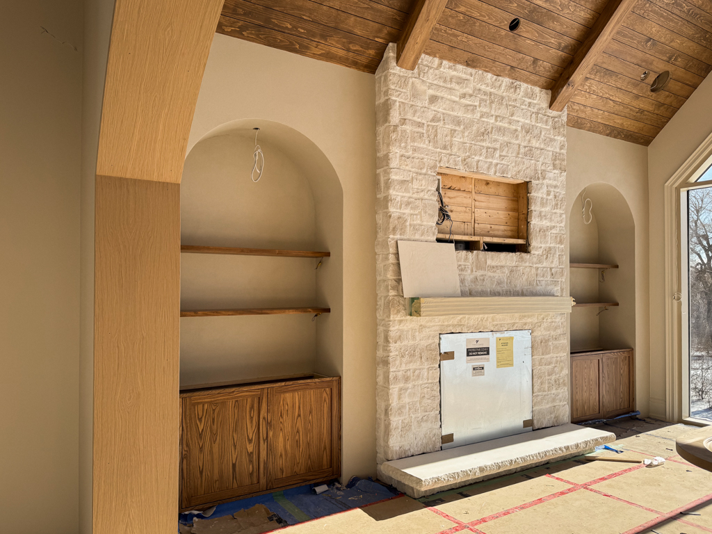 Custom Built-in Media Wall and Stone Fireplace after Microcement Application