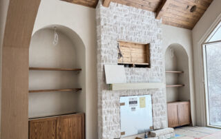 Custom great room featuring pine wood shiplap ceilings in a rich walnut stain, perfectly color-matched to modern built-in cabinetry of a media wall finished in microcement Kleinburg, Toronto.