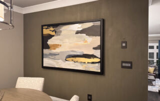 A finished Etobicoke dining room feature wall with a seamless, floor-to-ceiling bamboo-textured microcement finish in a soft, matte stone tone.