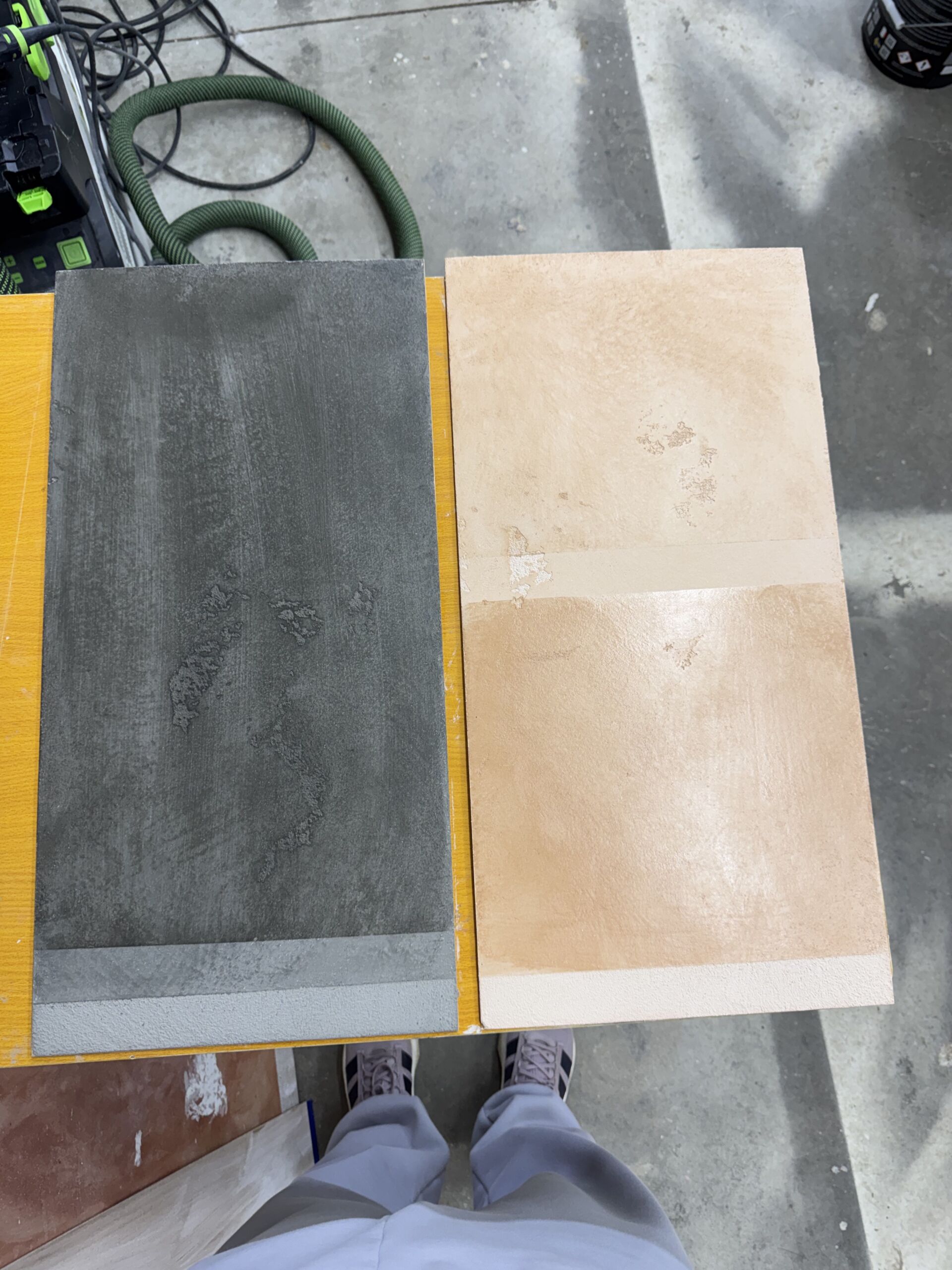 A side-by-side comparison of two Georgetown Beige Venetian plaster samples; one half is finished with a traditional matte soap sealer and the other with a polished protective wax.