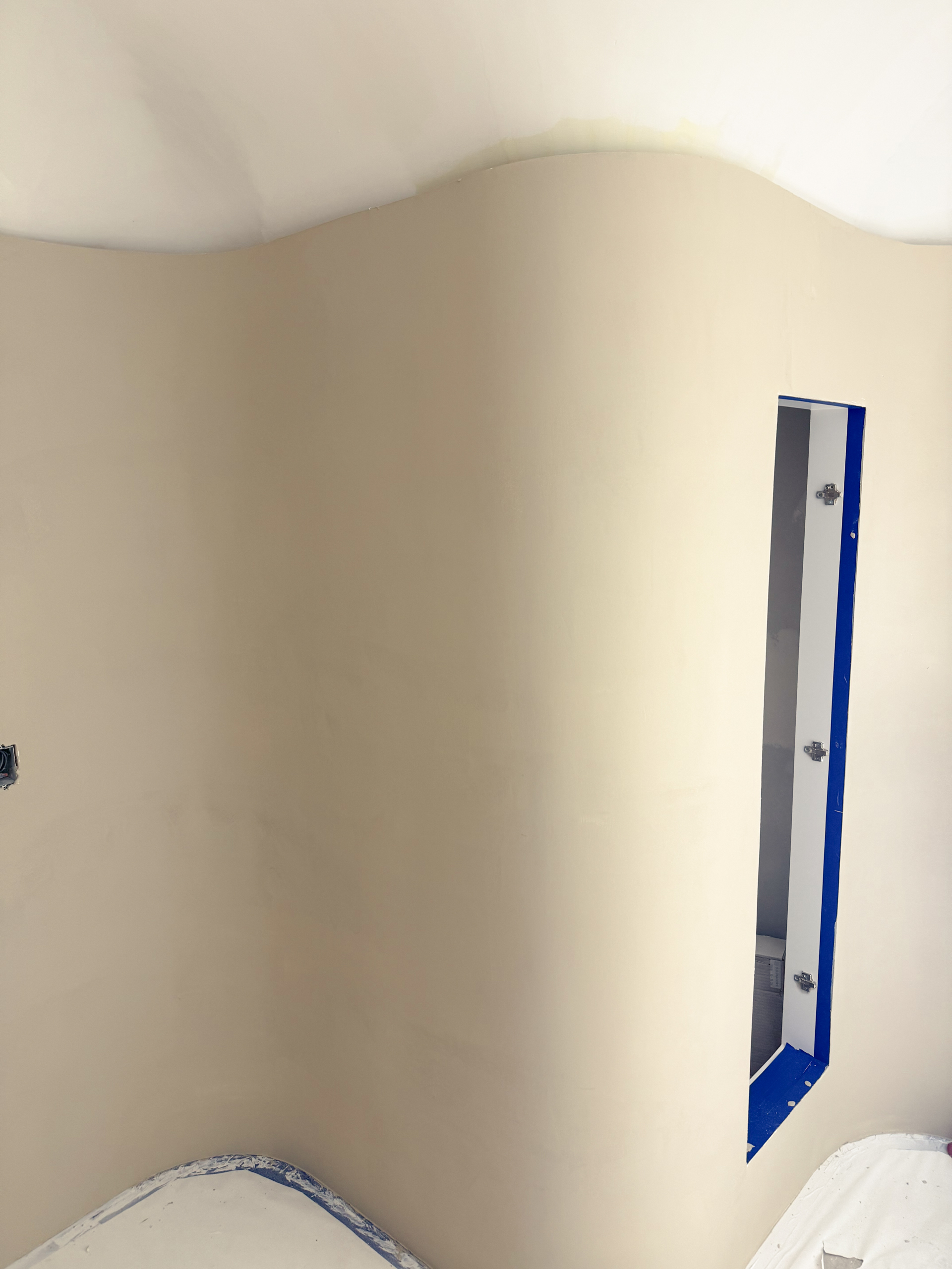 A contemporary home spa in Castle Frank, Toronto, featuring seamless soft grey microcement applied to the walls, closet doors, and a built-in vanity, finished with a matte, waterproof sealer.