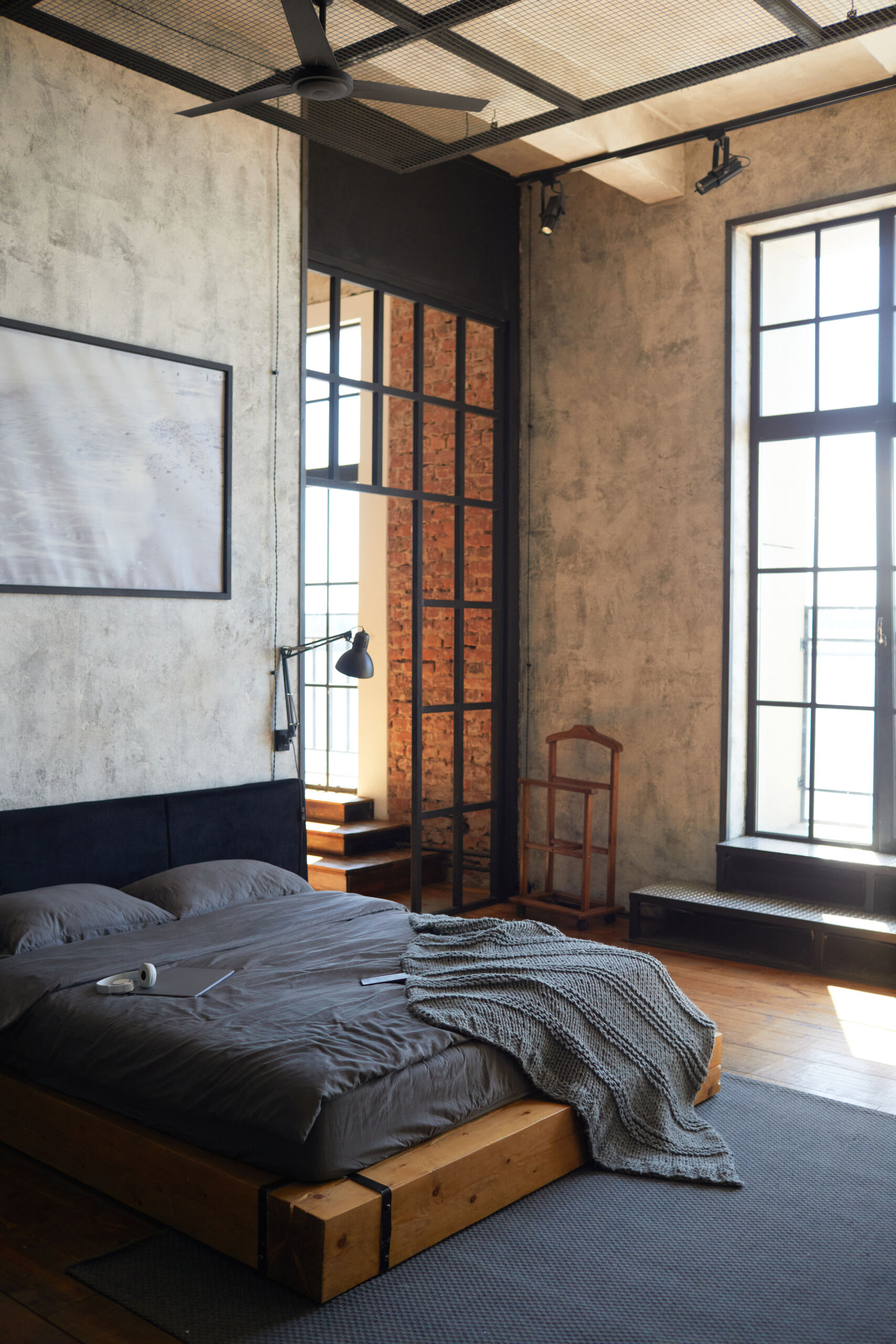 Loft Bedroom Interio Concrete effect WEalls Custom concrete effect wall toronto feature installation behind a bed in a modern Toronto loft bedroom.