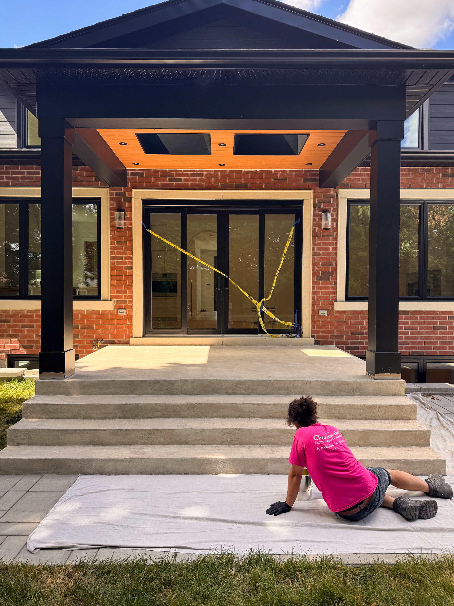 custom-warm-white-glaze-exterior-microcement-sealant The completed modern front porch and deck finished in a soft, warm off-white microcement glaze and protected with a clear exterior sealant.