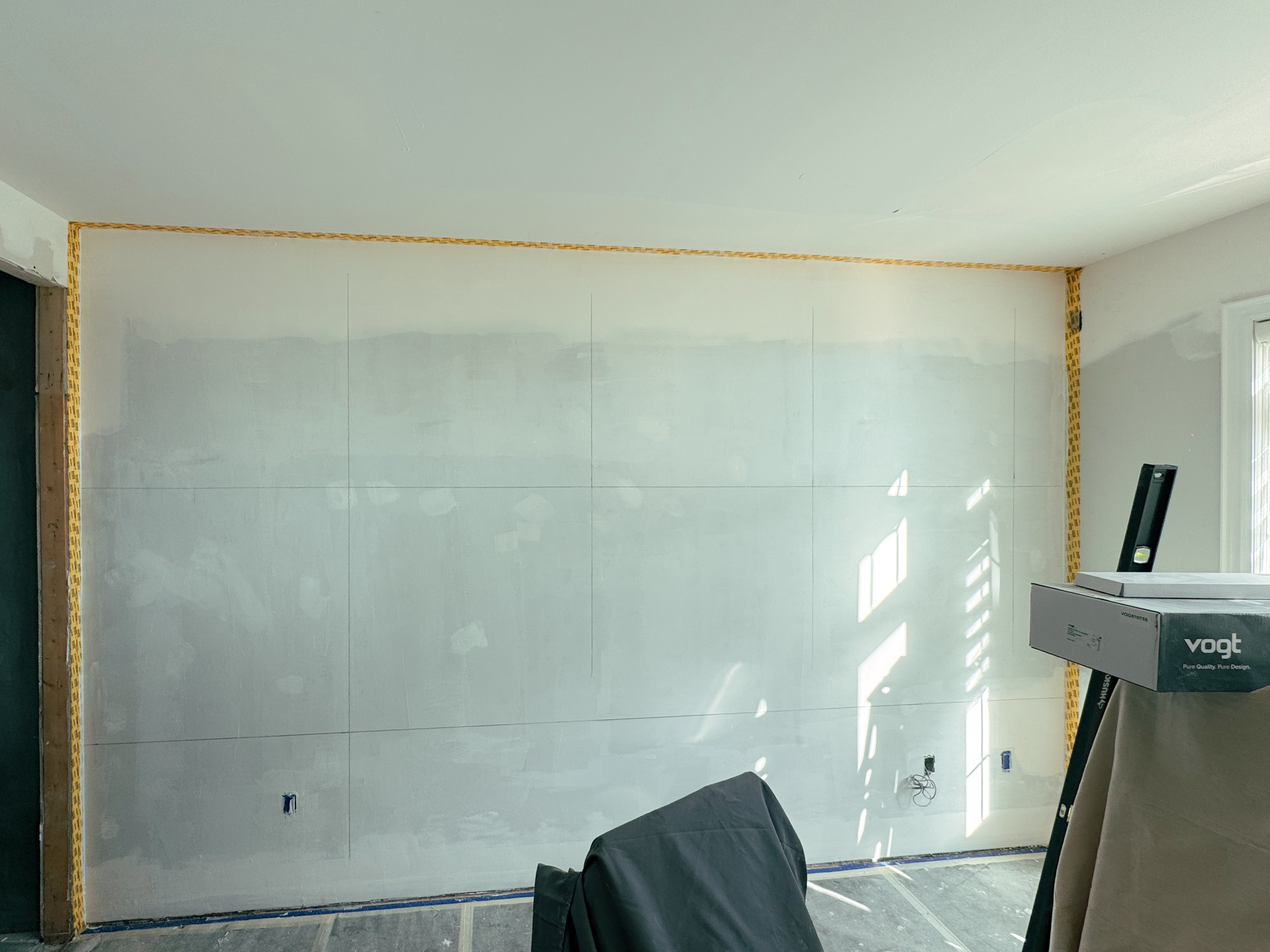 concrete-texture-wall-substrate-preparation-brampton Meticulous substrate preparation and priming for a custom concrete texture wall in a modern Brampton bedroom.
