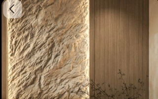 Custom rock effect wall toronto feature installation adjacent to custom millwork illuminated by soft white LED strip lighting.