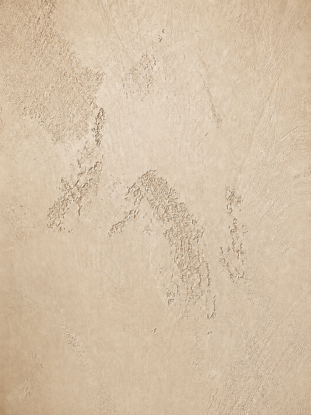 venetian-plaster-fireplace-world-map-design-master-bedroom4 Close-up of highly textured taupe Venetian plaster finish on a fireplace